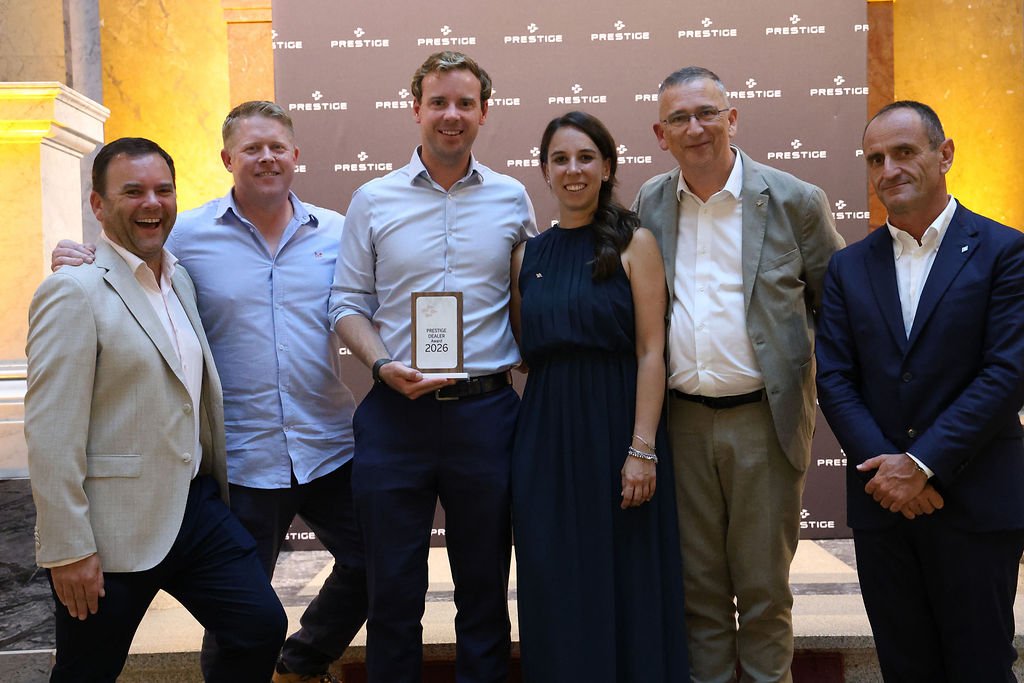 Ancasta International team accepting dealer award from Prestige Yachts